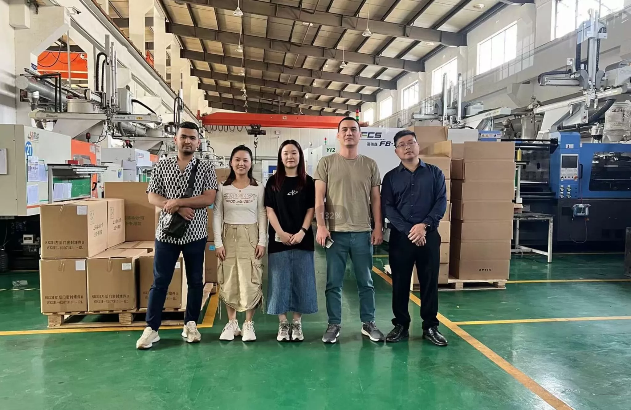Client delegation visiting the production floor with the GLT team
