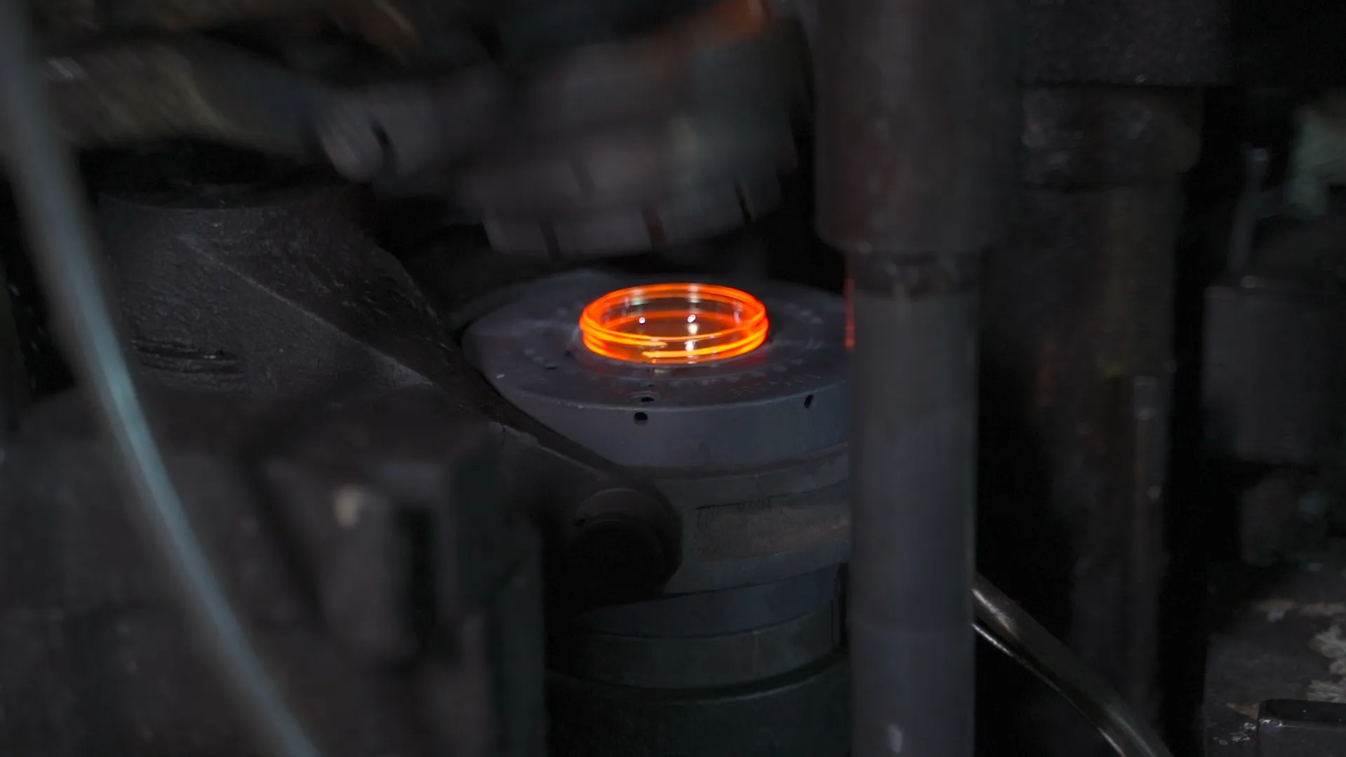 Hot glass container taking shape in an I.S. forming machine mold